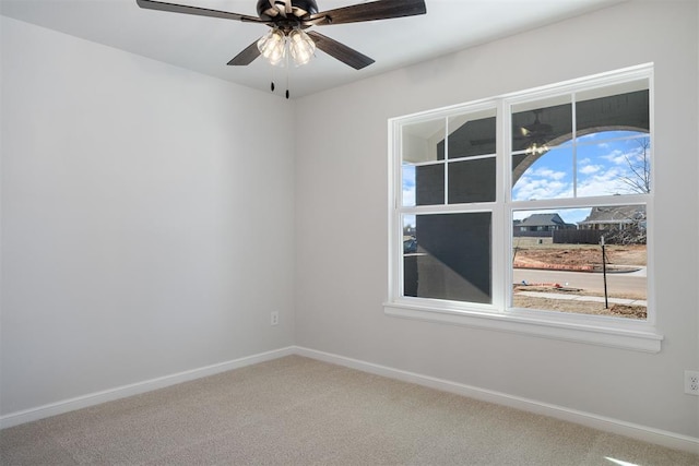 3400 Piney River Dr, Yukon, OK 73099 - unfurnished room with carpet flooring, a ceiling fan, and baseboards