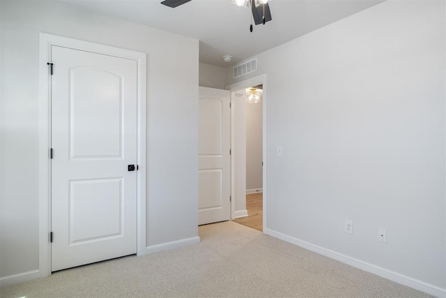 3400 Piney River Dr, Yukon, OK 73099 - unfurnished bedroom featuring a ceiling fan, carpet, visible vents, and baseboards