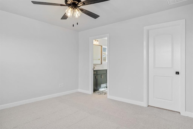 3400 Piney River Dr, Yukon, OK 73099 - unfurnished bedroom featuring light carpet, ensuite bath, baseboards, and ceiling fan