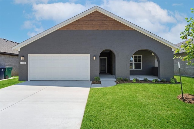 3400 Piney River Dr, Yukon, OK 73099 - view of front of home with brick siding, concrete driveway, a front lawn, a porch, and an attached garage