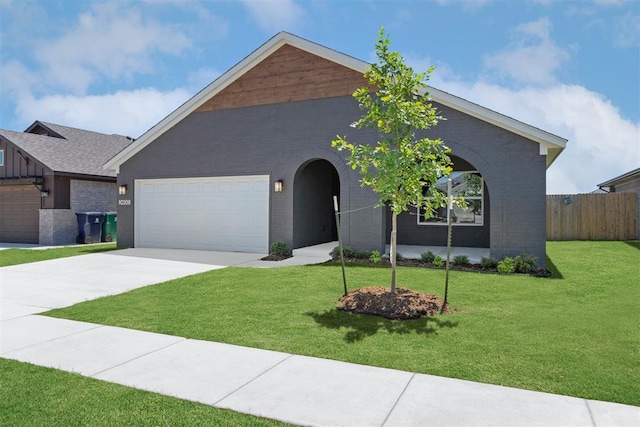 3400 Piney River Dr, Yukon, OK 73099 - view of front of property featuring an attached garage, brick siding, and driveway