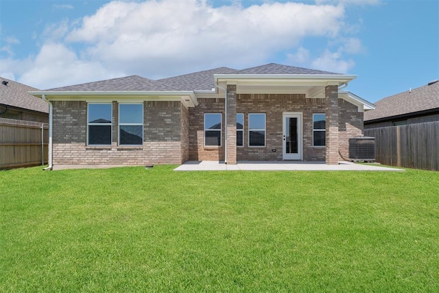 3400 Piney River Dr, Yukon, OK 73099 - rear view of property with a fenced backyard, brick siding, a patio, and a shingled roof
