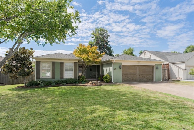 ranch-style house featuring a garage and a front lawn