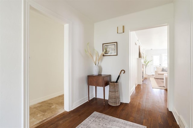 hallway with dark hardwood / wood-style floors