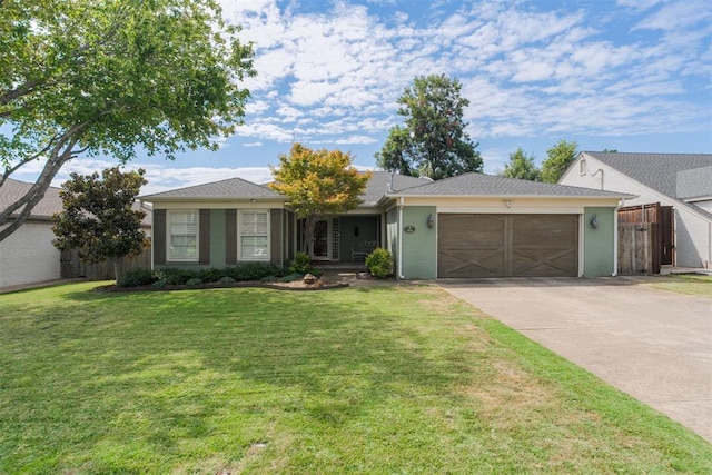 ranch-style house with a garage and a front lawn