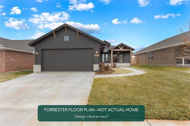 view of front of home with a garage and a front lawn