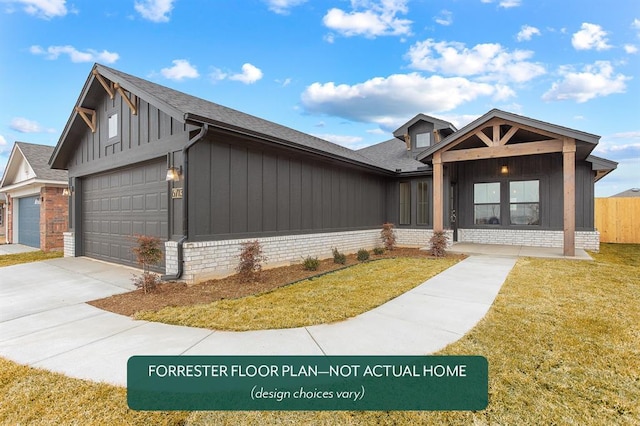 view of front of home with a garage and a front yard