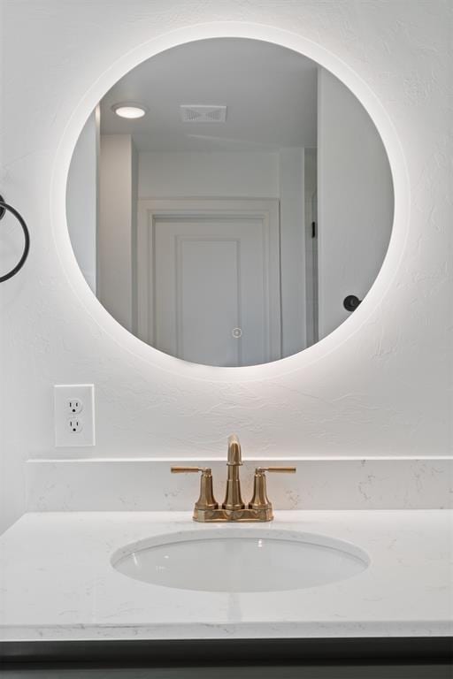 bathroom with visible vents and vanity