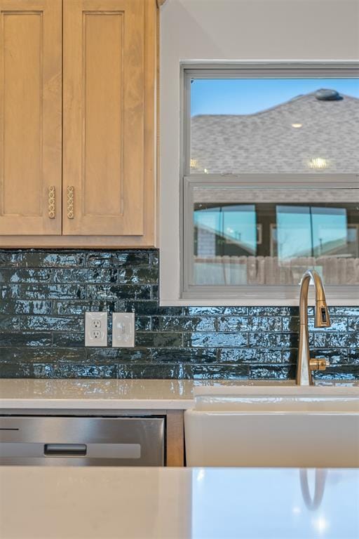 kitchen featuring a sink and backsplash