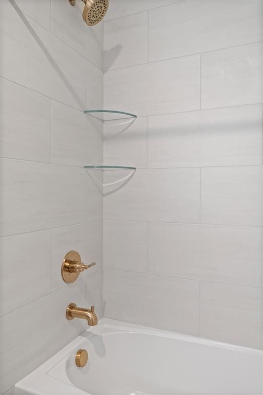 bathroom with shower / bathing tub combination