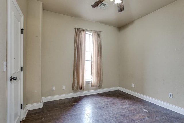 spare room featuring ceiling fan and dark hardwood / wood-style floors