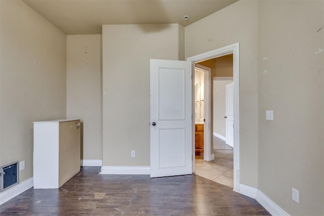 empty room with wood-type flooring