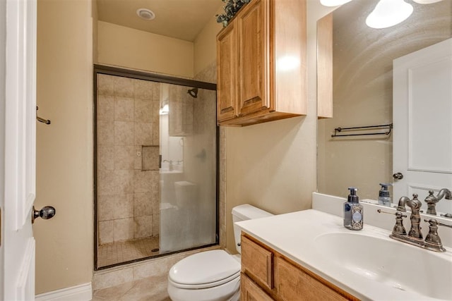 bathroom featuring walk in shower, vanity, and toilet