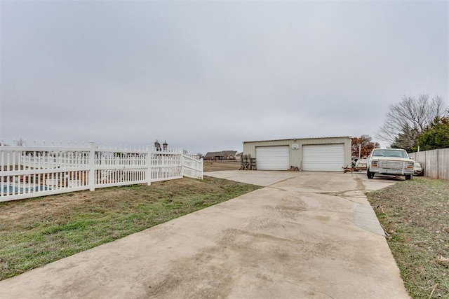 exterior space with an outbuilding and a garage