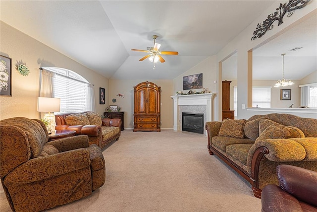 living room with lofted ceiling, plenty of natural light, and light carpet