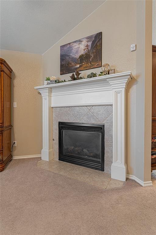 details featuring carpet flooring and a tiled fireplace