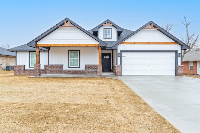 craftsman-style home with a garage and central AC