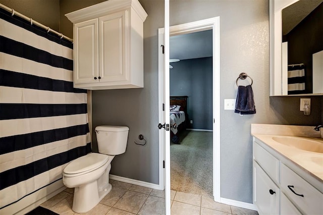 bathroom featuring tile patterned floors, toilet, and vanity