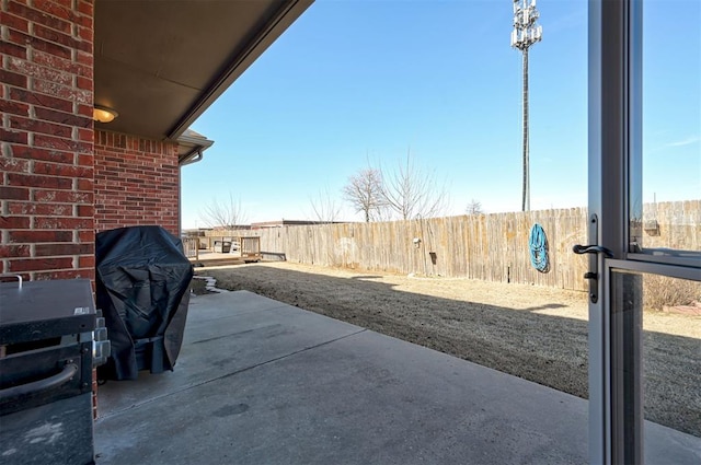 view of patio with a grill