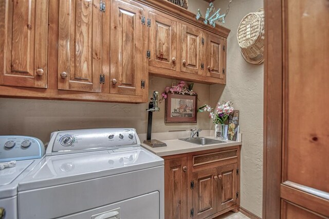 3225 Cotswold Sq, Norman, OK 73072 - laundry area featuring sink, washing machine and dryer, and cabinets
