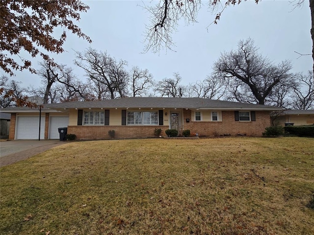 ranch-style home with a garage and a front yard