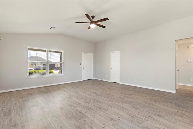 empty room with vaulted ceiling, light hardwood / wood-style floors, and ceiling fan