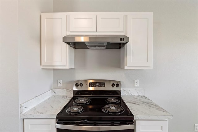 kitchen with white cabinets, wall chimney exhaust hood, and stainless steel electric range