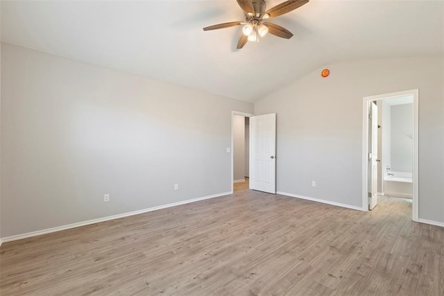 unfurnished bedroom with ceiling fan, ensuite bathroom, vaulted ceiling, and light hardwood / wood-style flooring