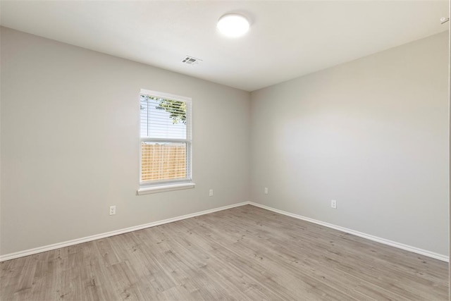 unfurnished room featuring light hardwood / wood-style floors