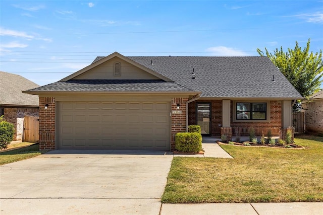 ranch-style house with a garage and a front yard