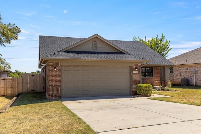 ranch-style home with a garage and a front yard