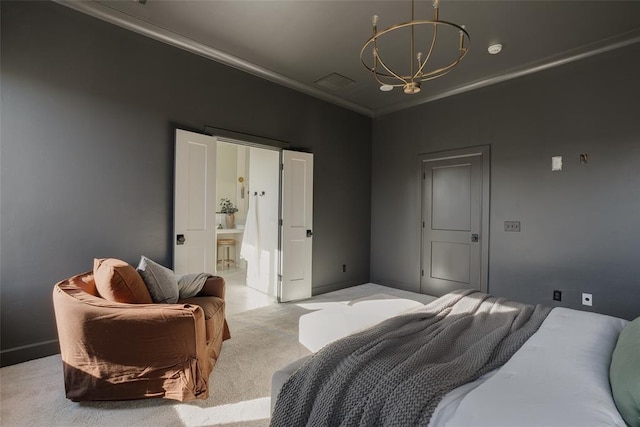 carpeted bedroom with crown molding, ensuite bathroom, and a notable chandelier