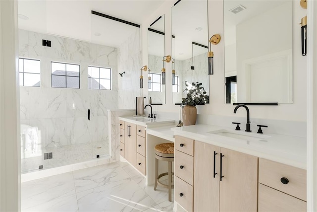 bathroom featuring vanity and a shower with door