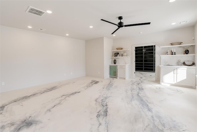 unfurnished living room featuring ceiling fan