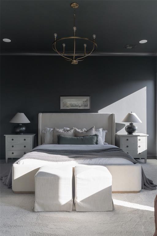 carpeted bedroom featuring crown molding