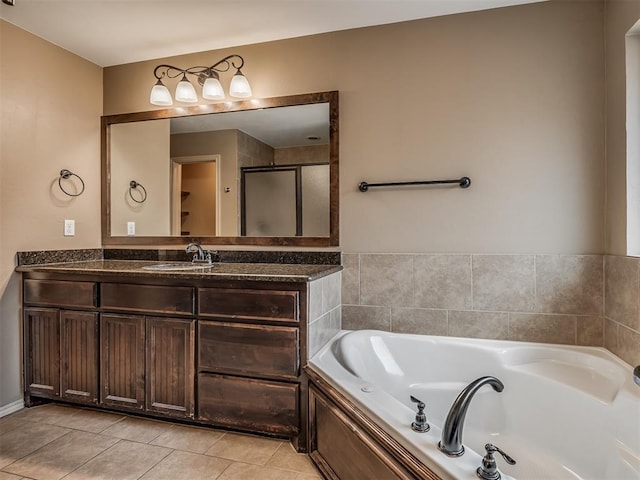 bathroom with vanity, tile patterned floors, and independent shower and bath