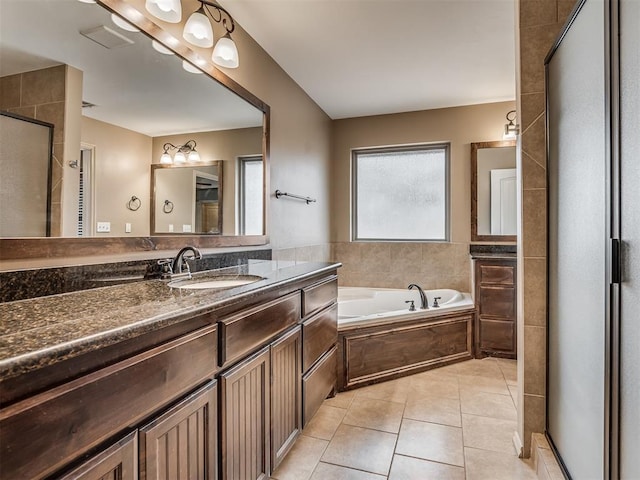 bathroom featuring vanity, separate shower and tub, and tile patterned flooring