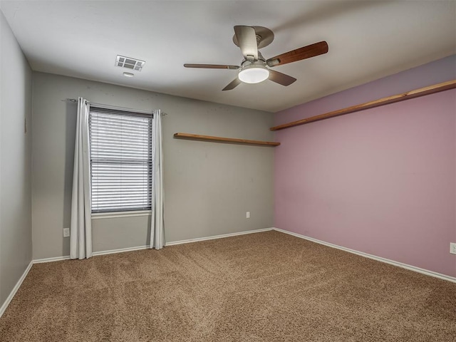 spare room with carpet flooring and ceiling fan