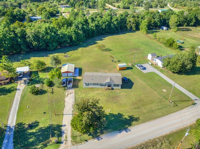 birds eye view of property featuring a rural view