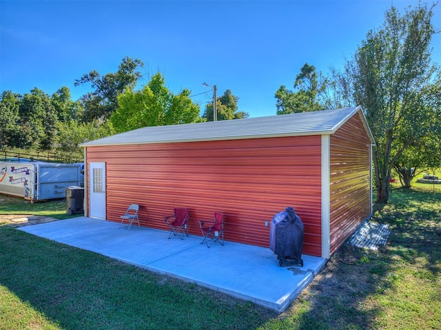 view of outbuilding featuring a yard