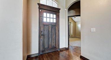 entrance foyer featuring dark hardwood / wood-style flooring