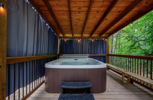 deck featuring a hot tub