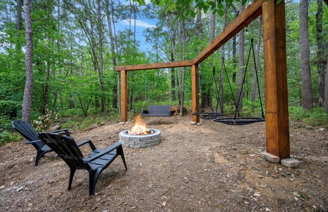 view of yard with a fire pit