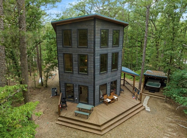 view of outbuilding with a hot tub