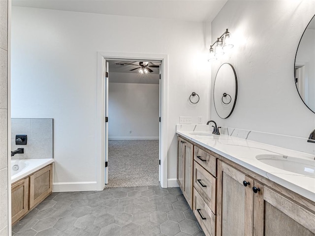 bathroom featuring vanity and a washtub