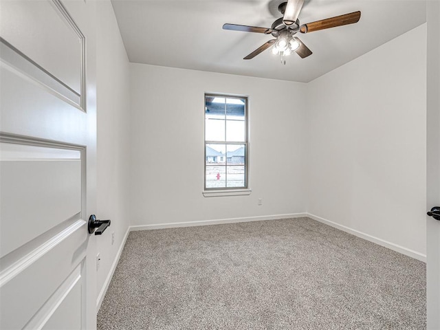 unfurnished room with ceiling fan and carpet flooring