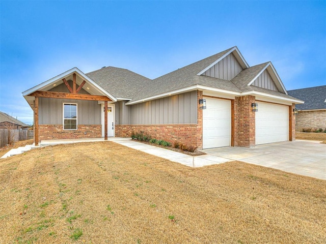 view of front of home featuring a garage and a front yard