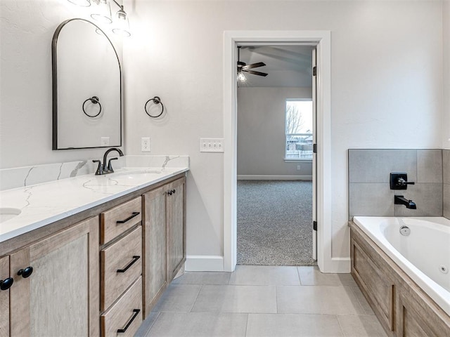 bathroom featuring vanity, tiled bath, and tile patterned floors