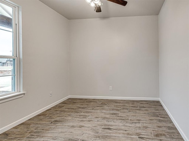 unfurnished room with hardwood / wood-style floors and ceiling fan