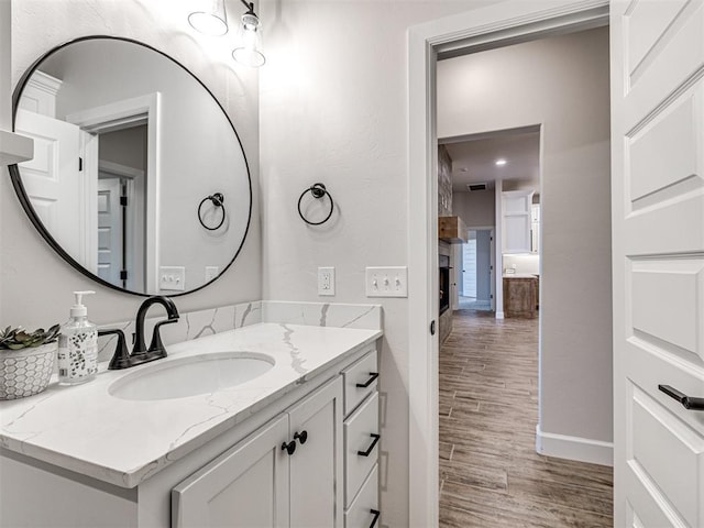 bathroom with wood-type flooring and vanity